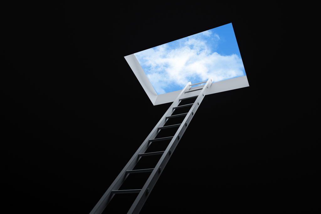 A silver ladder leads out of the dark to a hole in the ceiling and a bright blue sky with a few clouds above.