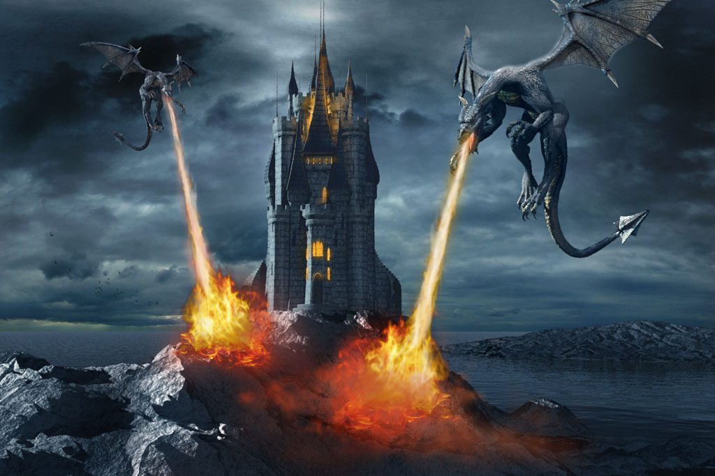 Two gray dragons fly overtop of a castle on a hill and breathe orange flames down on it.