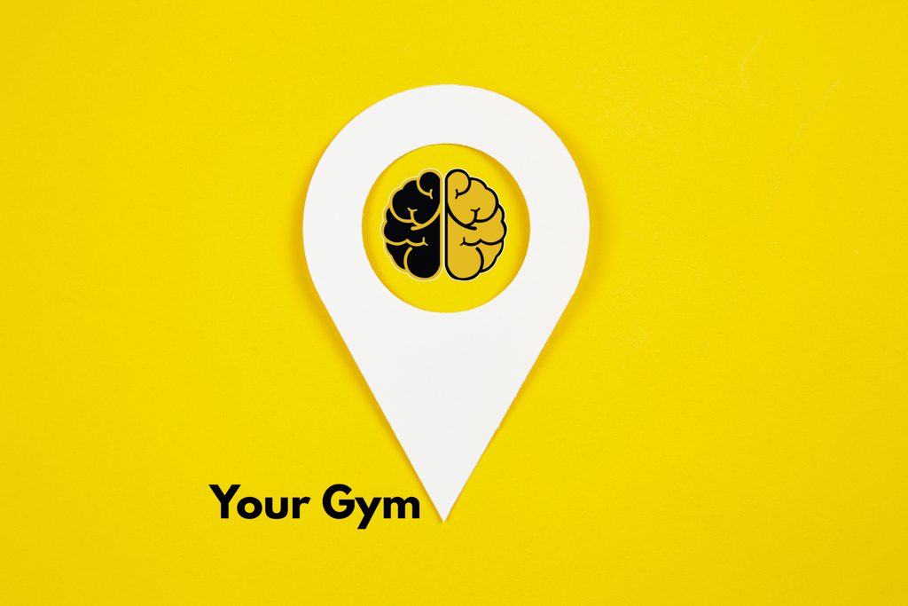 On a yellow background, a white map point icon points to the words "your gym."