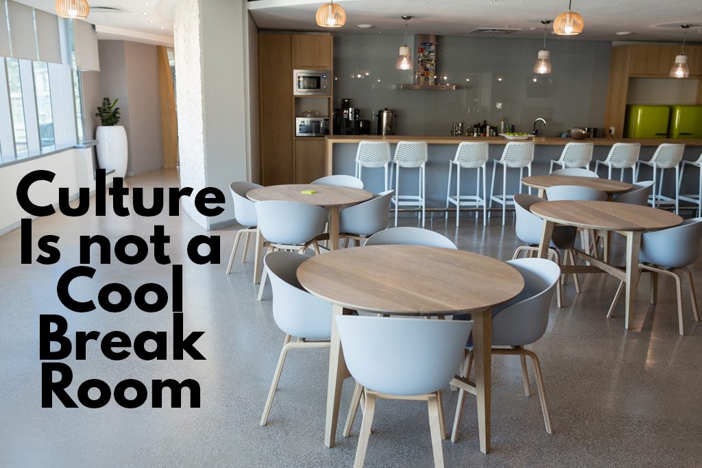 A clean, stylish business cafeteria with the words "culture is not a cool break room."
