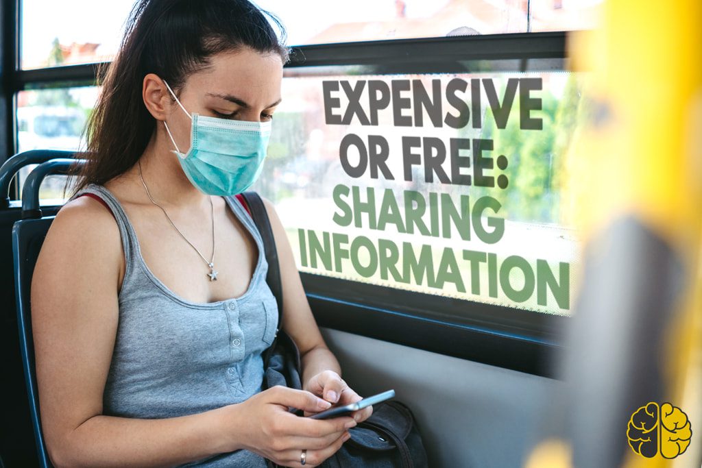 A woman wearing a face mask on the bus looking at her smartphone