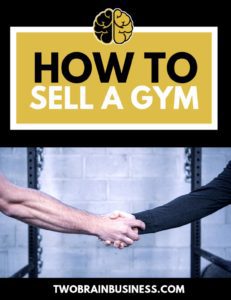 How to sell a gym—two people shake hands in front of a squat rack.