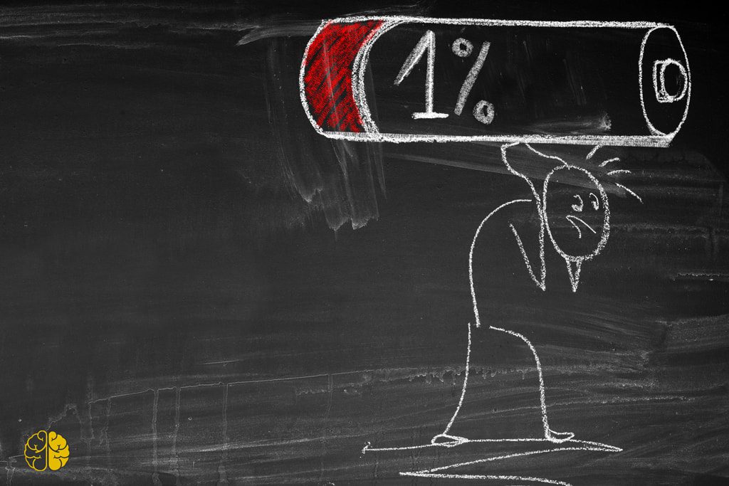 A chalk drawing of a stick man struggling under the weight of a depleted battery