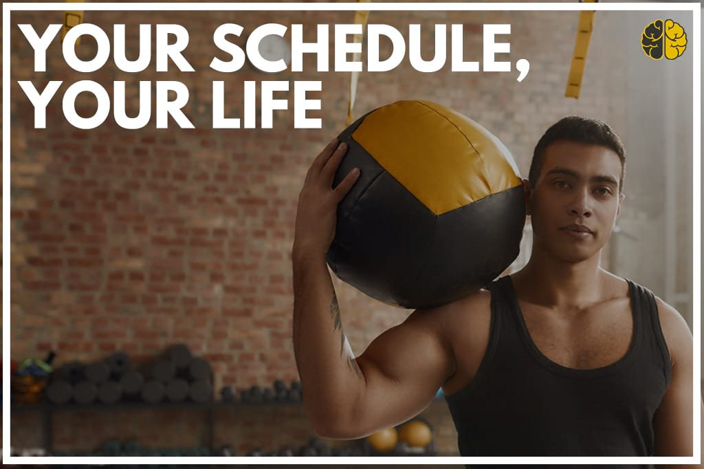 A gym-goer balancing a medicine ball on his shoulder - your schedule, your life