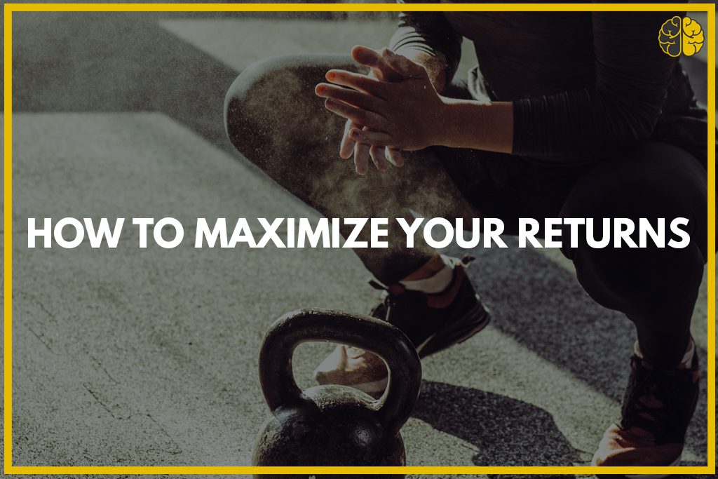 A woman getting ready to lift a kettlebell - how to maximize your return