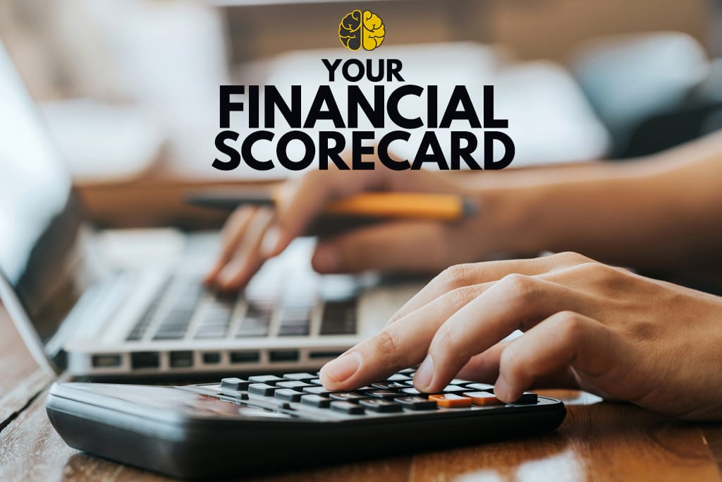 A woman using a calculator - your financial scorecard