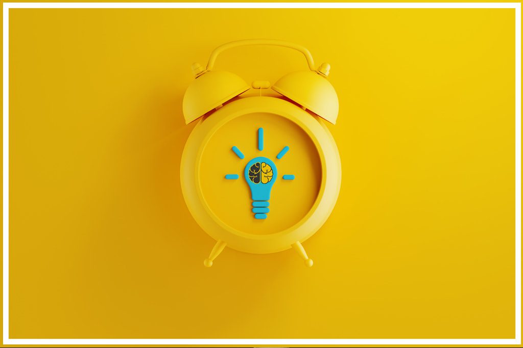 A yellow alarm clock containing the Two-Brain Logo - how to maximize your time