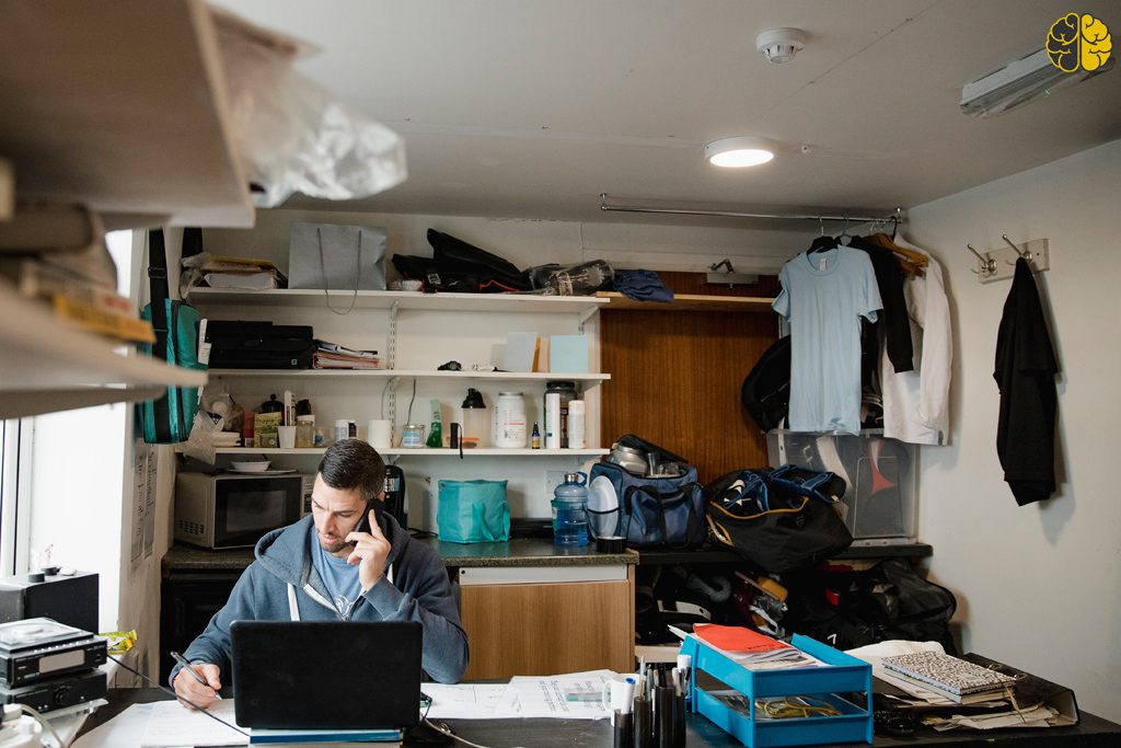The Real Cost of Doing Everything Yourself - a gym owner muddling thru paperwork at his desk