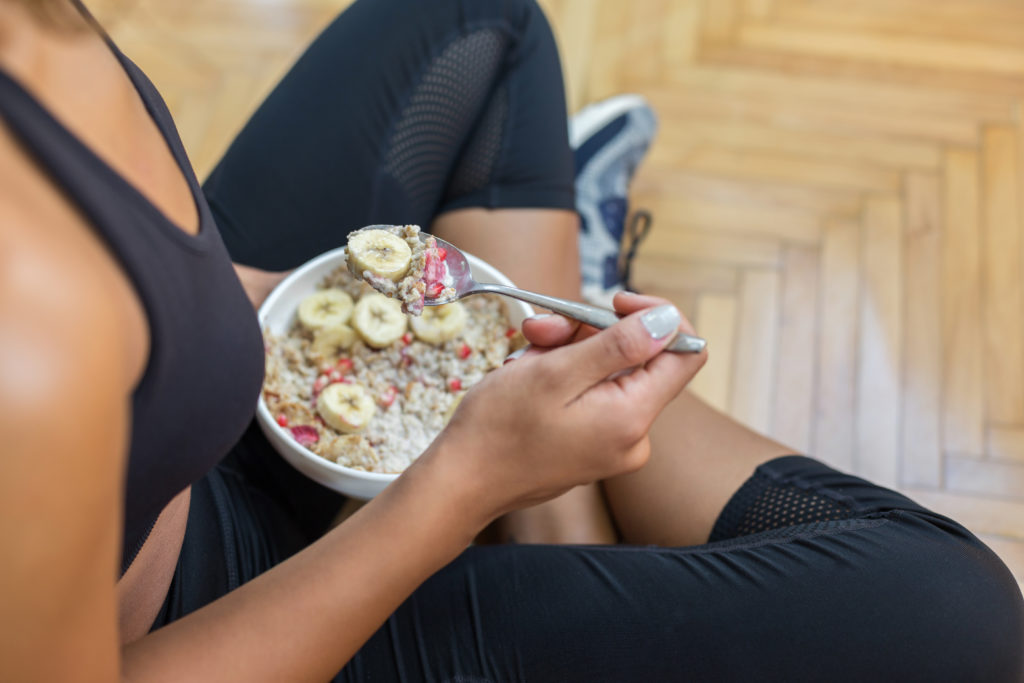 Intramural Open Guide - a woman eating oatmeal the day before an Open workout.