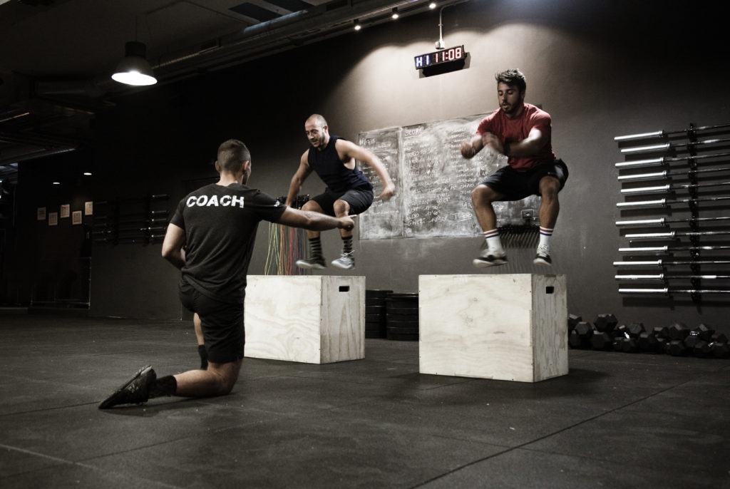 Intramural Open Guide - Clients jumping on boxes in preparation for the CrossFit Games Open.