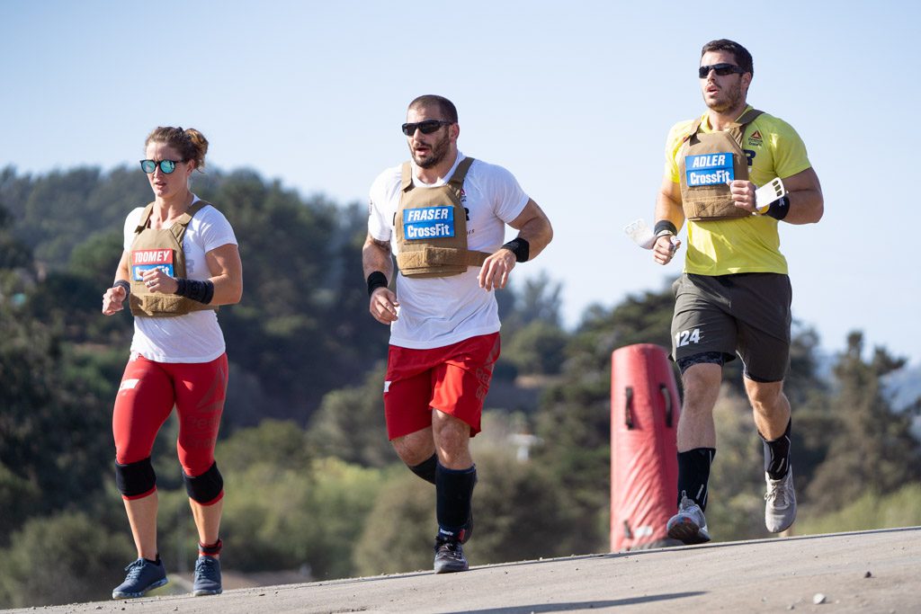 Mat Fraser, Tia-Clair Toomey-Orr and Jeffrey Adler run during the 2020 CrossFit Games.