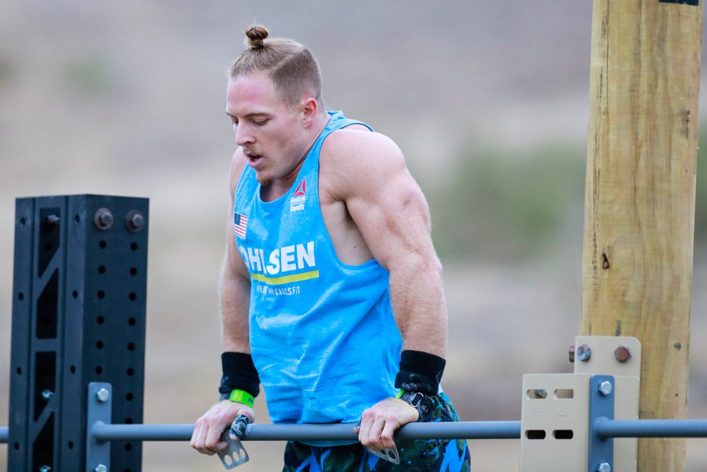 Noah Ohlsen at the top of a bar muscle-up at the 2020 CrossFit Games.