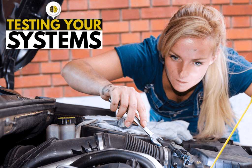 A woman adjusting under the hood of a car - testing your systems