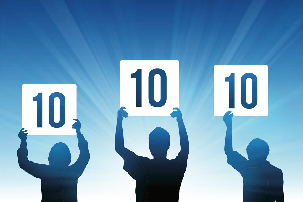 A silhouette illustration of three people holding up "perfect 10" signs.