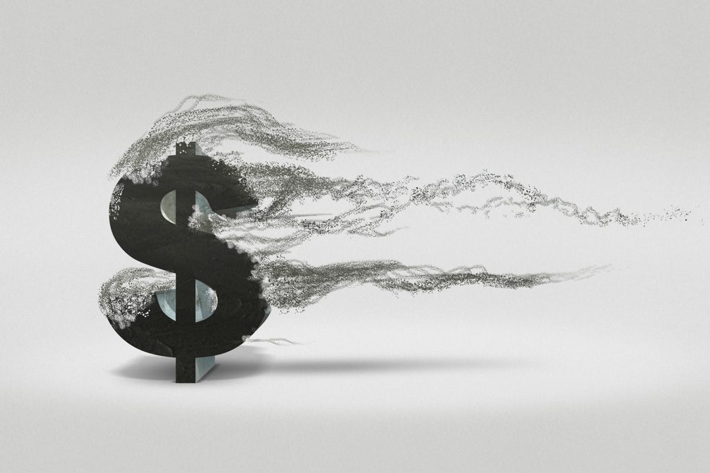 A graphic in which a black dollar sign is slowly crumbling to dust.