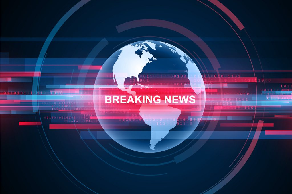 A blue graphic showing a globe with the red words "breaking news."