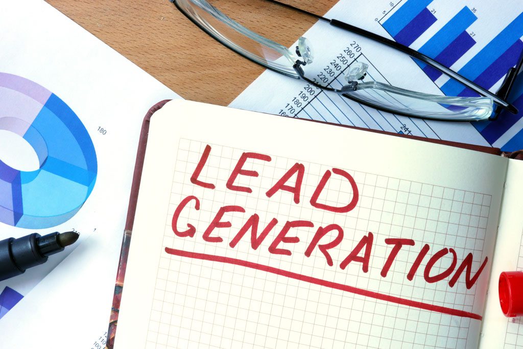 The words "lead generation" written on a notebook in large red letters.