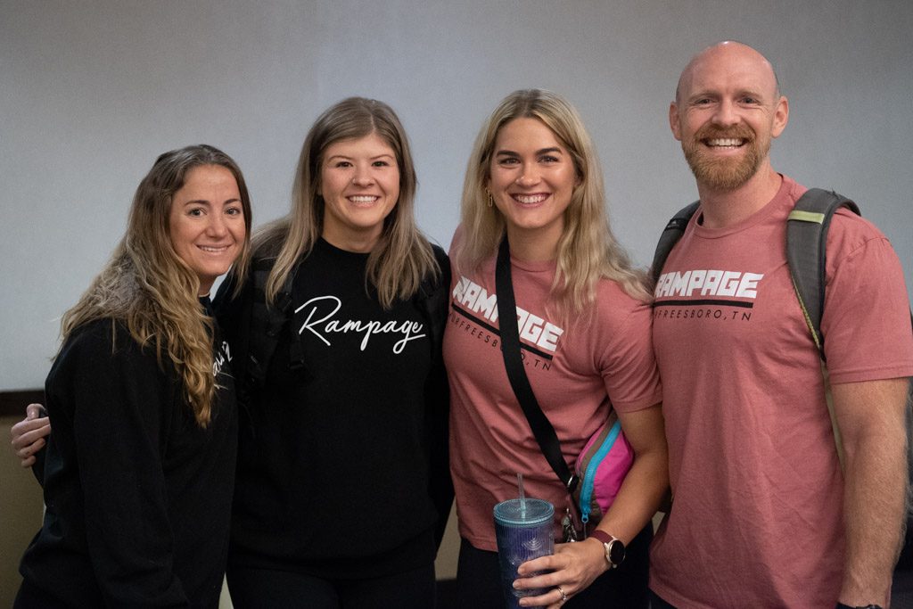 A group of Rampage coaches smile at the 2022 Two-Brain Summit in Chicago.