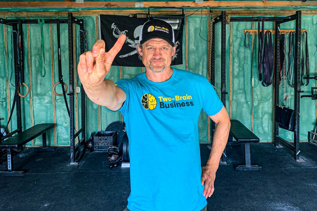 A gym owner waves his finger to indicate others should stop doing certain things in their businesses.
