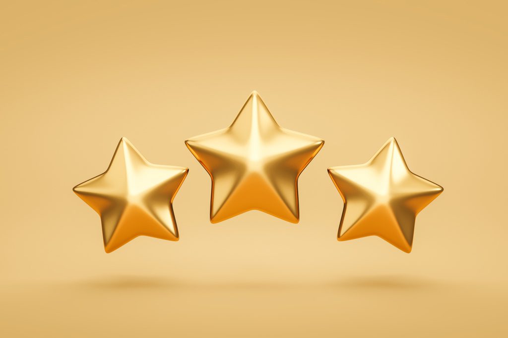 A graphic showing three gold stars on a gold background.