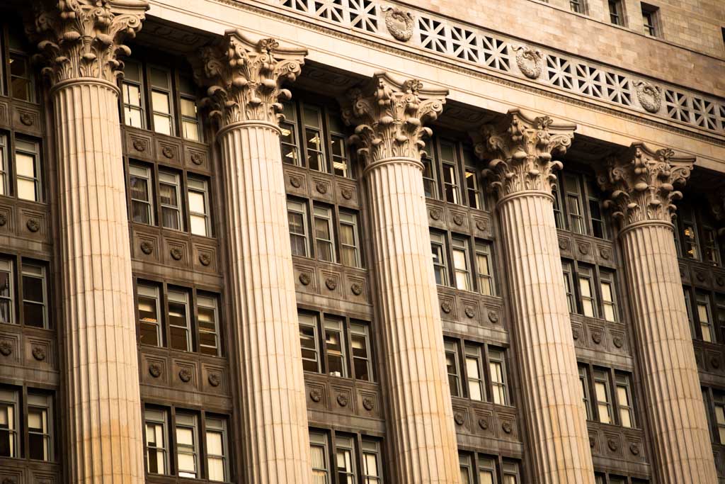 A closeup of five pillars on Chicago City Hall.