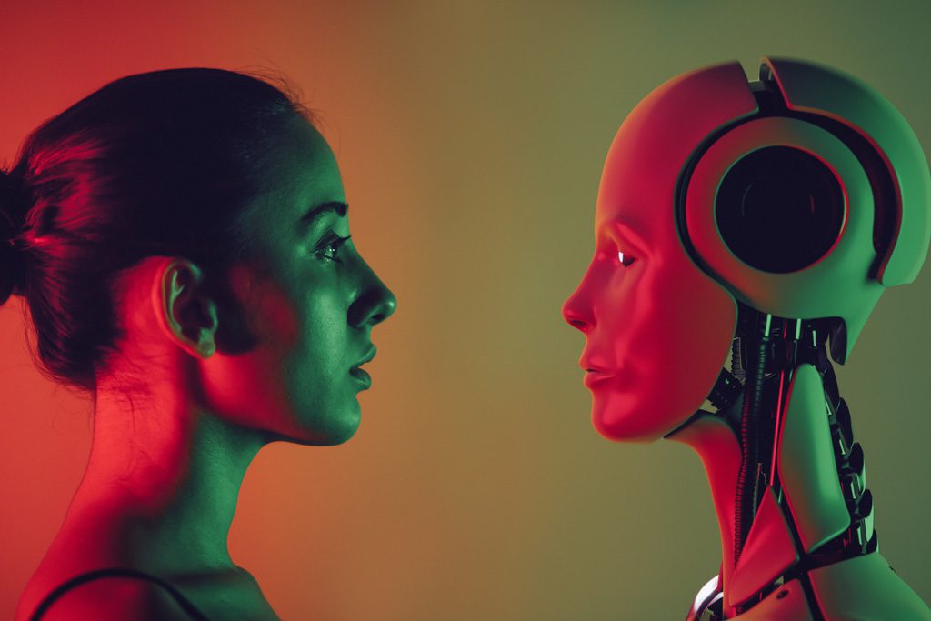 A closeup of a woman facing a robot with eerie green and red lighting.