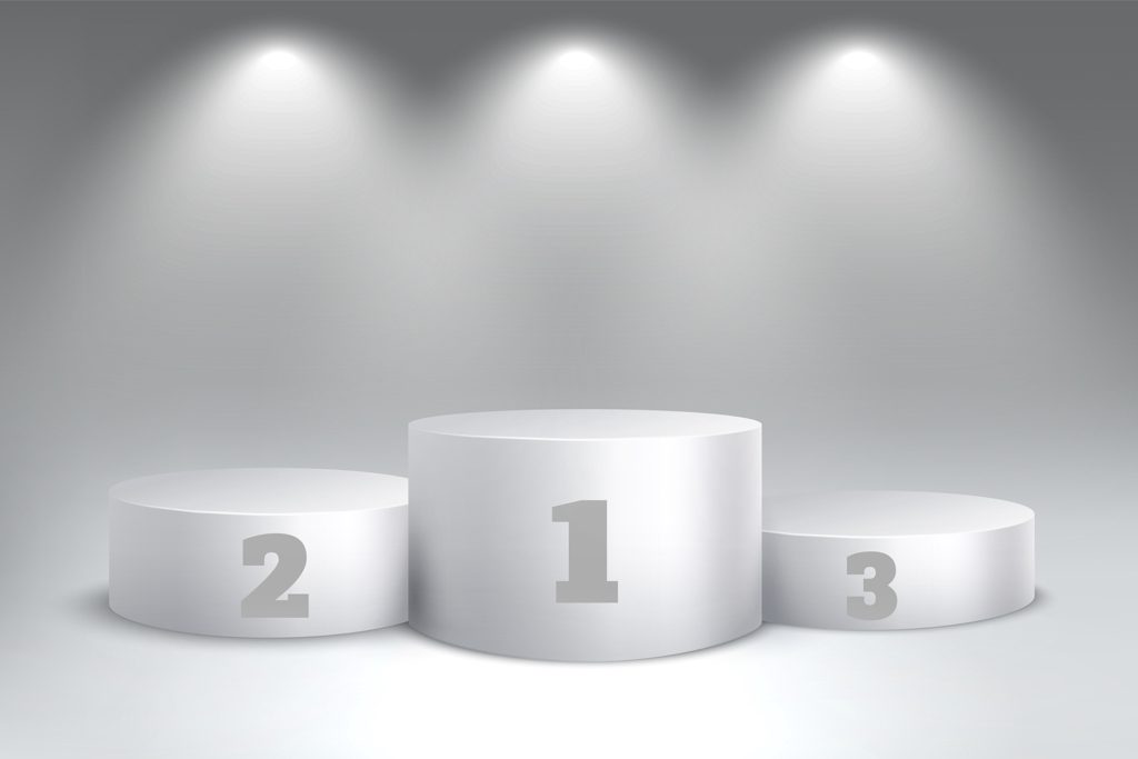 A graphic showing empty first-, second- and third-place photos beneath spotlights.