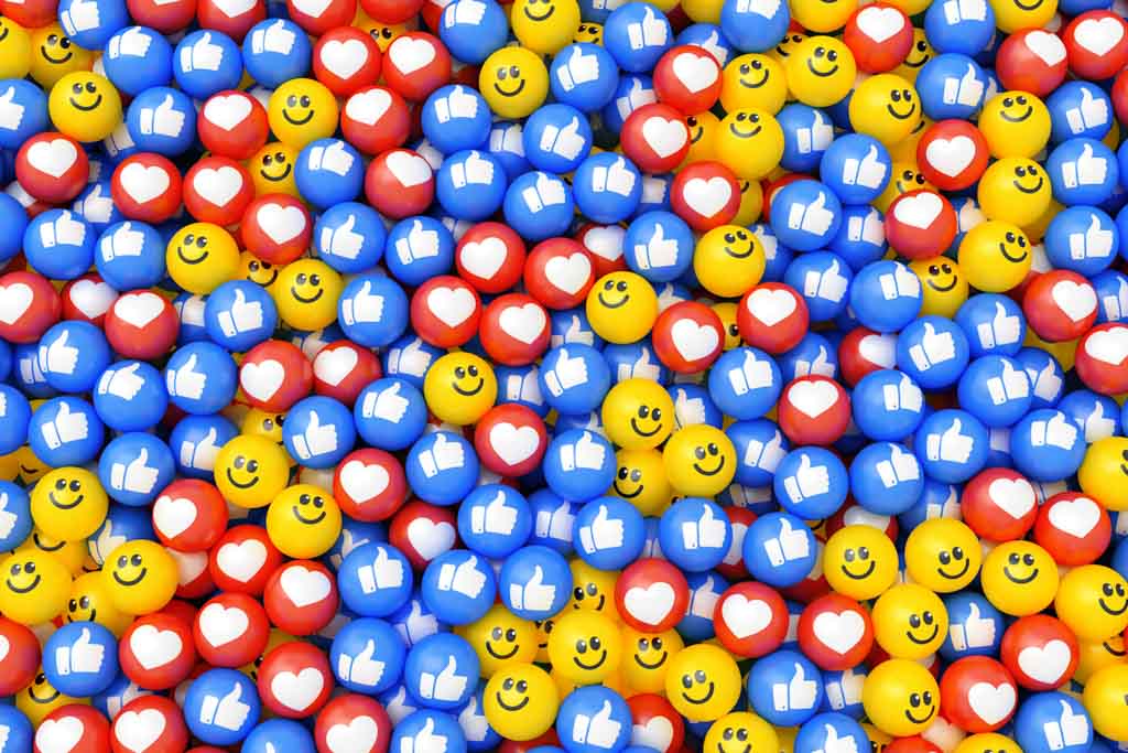 A large collection of social-media icons—happy faces, hearts and blue thumbs-up symbols.