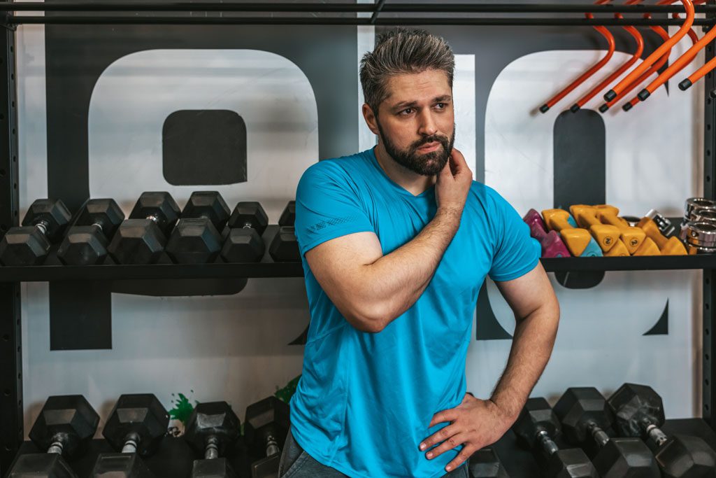 A confused gym owner scratches his chin and wonders how to get more clients.