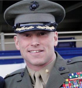 A portrait headshot of Brian Chontosh in U.S. Marines uniform.