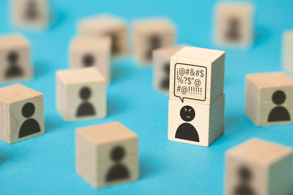 Among a sea of wooden blocks with "staff" icons on them, one icon has a thought bubble with very angry words in it.
