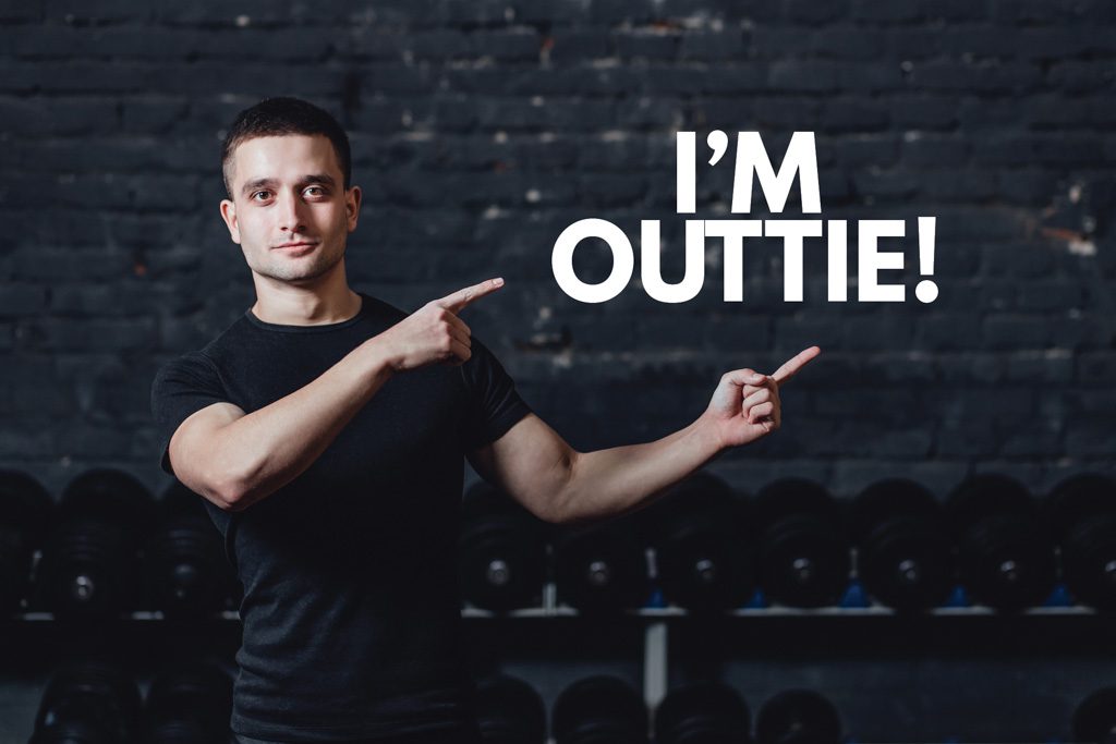 A photo of a gym staff member pointing to a quote bubble that says "I'm outtie!"