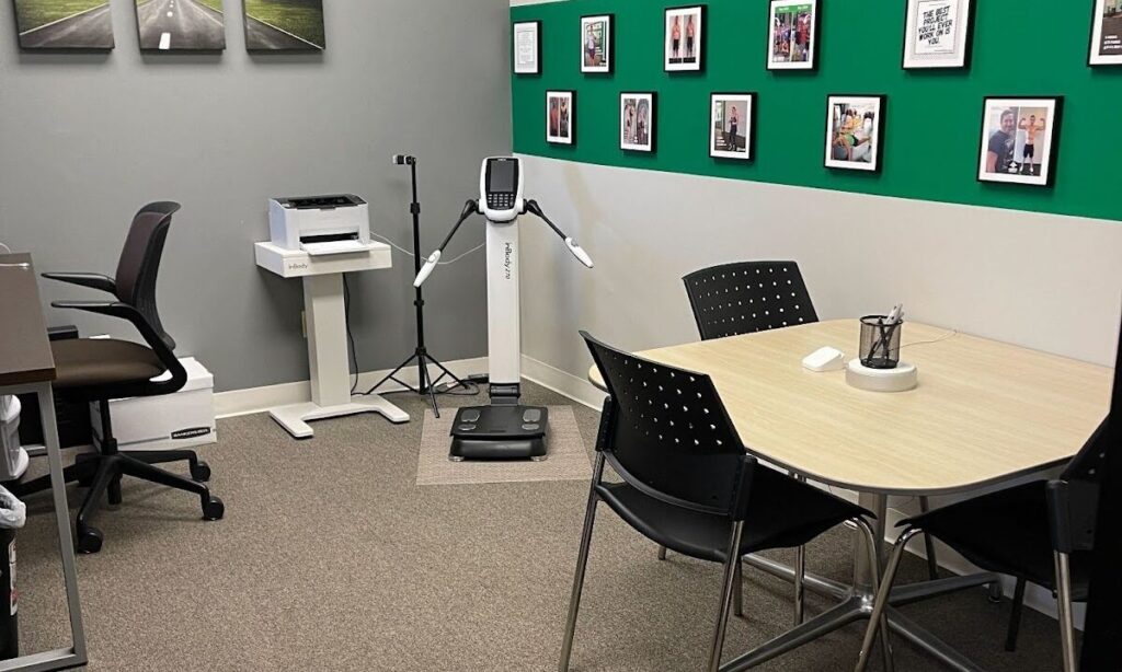 A photo of a clean, professional sales office in a gym.