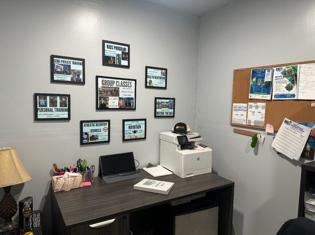 A photo of a clean, professional sales office in a gym.