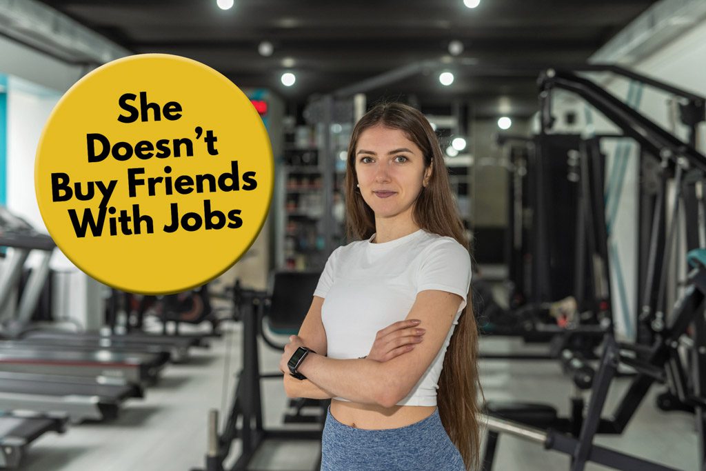 A gym owner poses in her facility with the caption "she doesn't buy friends with jobs."