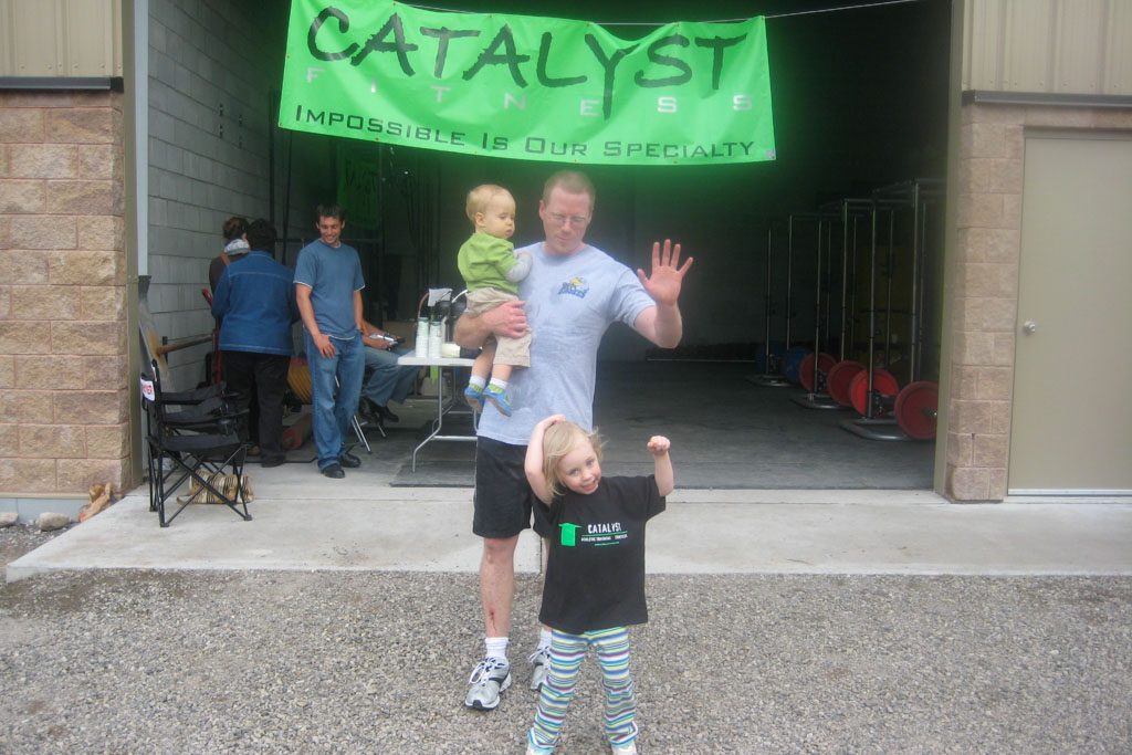 A photo of Chris Cooper and his children at Catalyst fitness in Sault Ste. Marie.