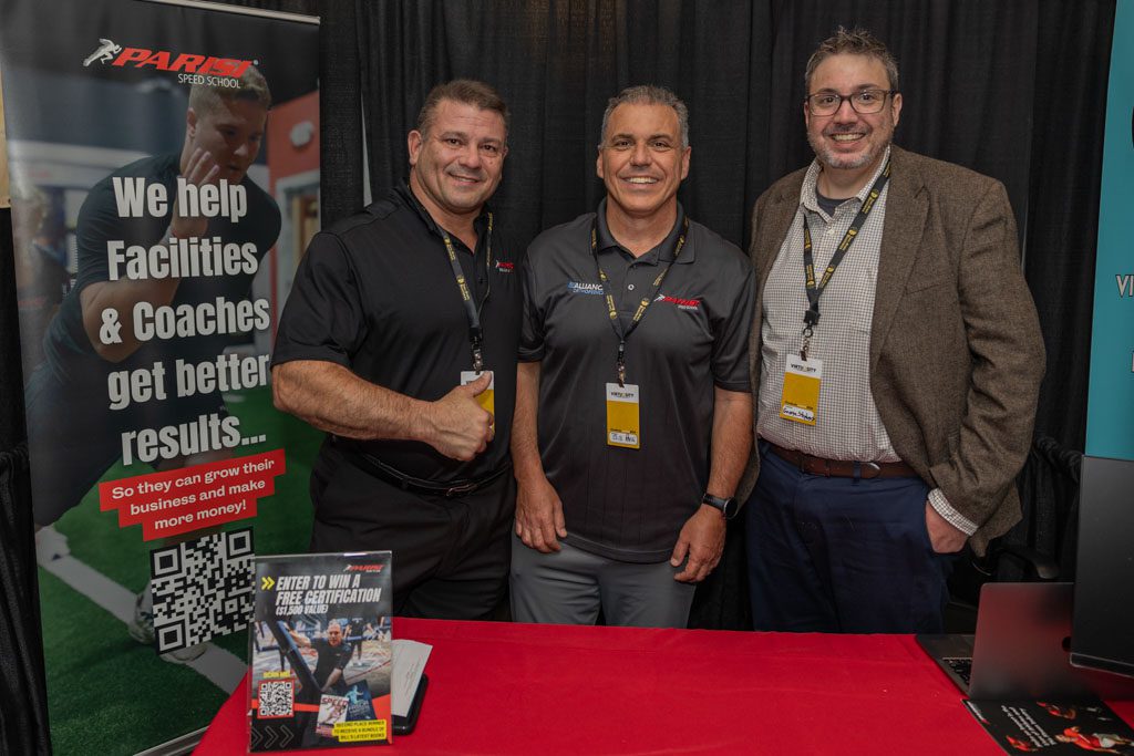 Bill Parisi poses with staff members from Parisi Speed School at the Two-Brain Summit.