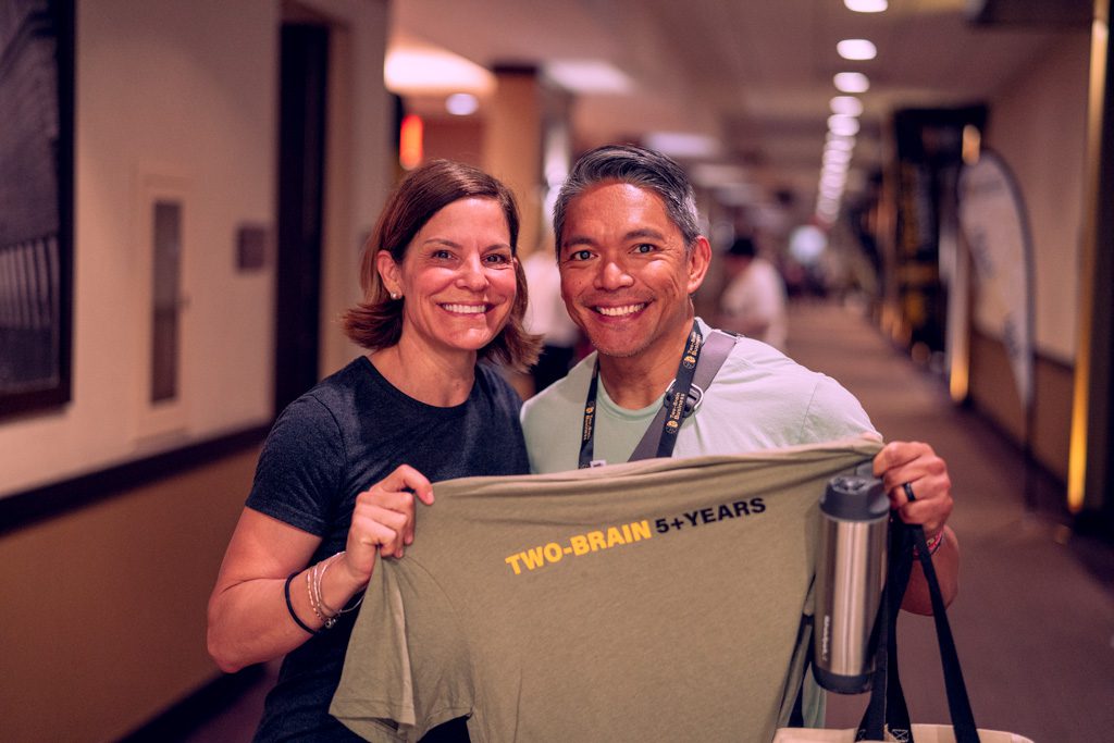 Happy, smiling gym owners at the Two-Brain Summit.