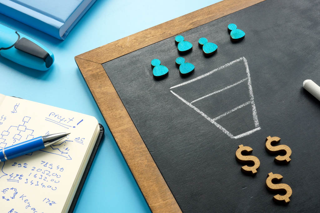 A photo showing people icons entering a sales funnel that produces dollar signs.