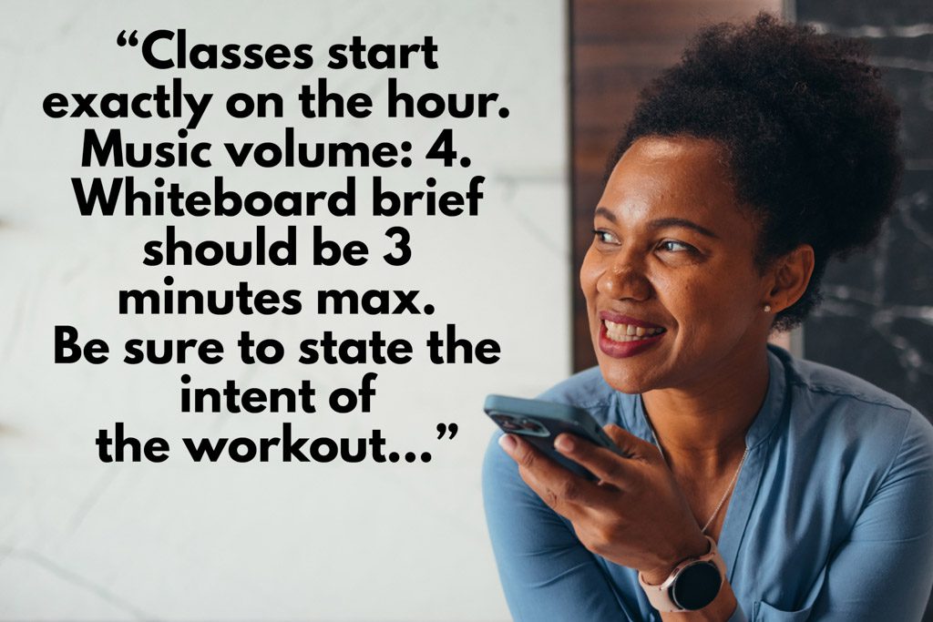 A gym owner uses a smartphone to dictate her staff playbook.