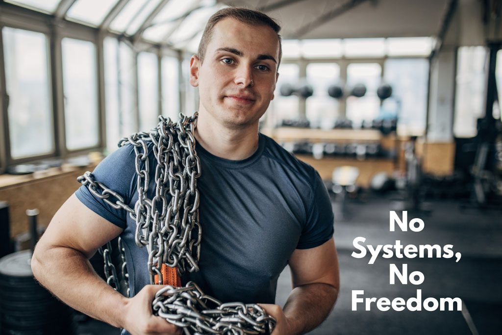A downtrodden gym owner who can't take time off carries a load of chains around his gym.