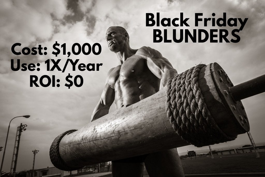 A muscled man lifts a strongman log.