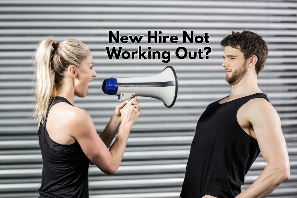 A female fitness coach yells at a gym client through a megaphone with the caption "new hire not working out?"
