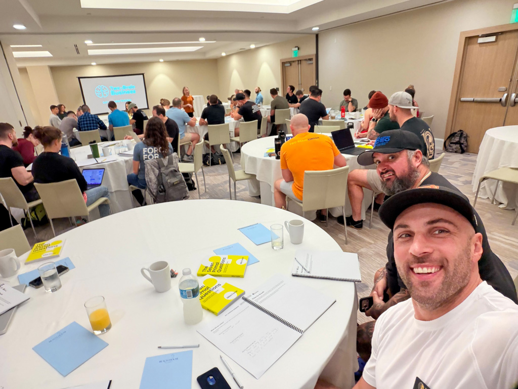 Two happy gym owners take a selfie during a seminar in Fort Lauderdale.
