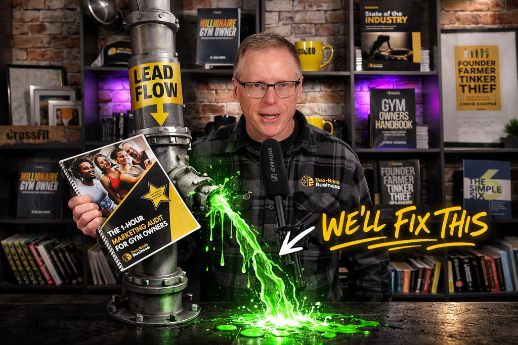 A photo of Chris Cooper with his new guide "The 1-Hour Marketing Audit for Gym Owners."