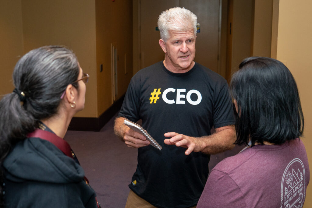 CrossFit CEO Bruce Edwards speaking with gym owners at the Two-Brain Summit