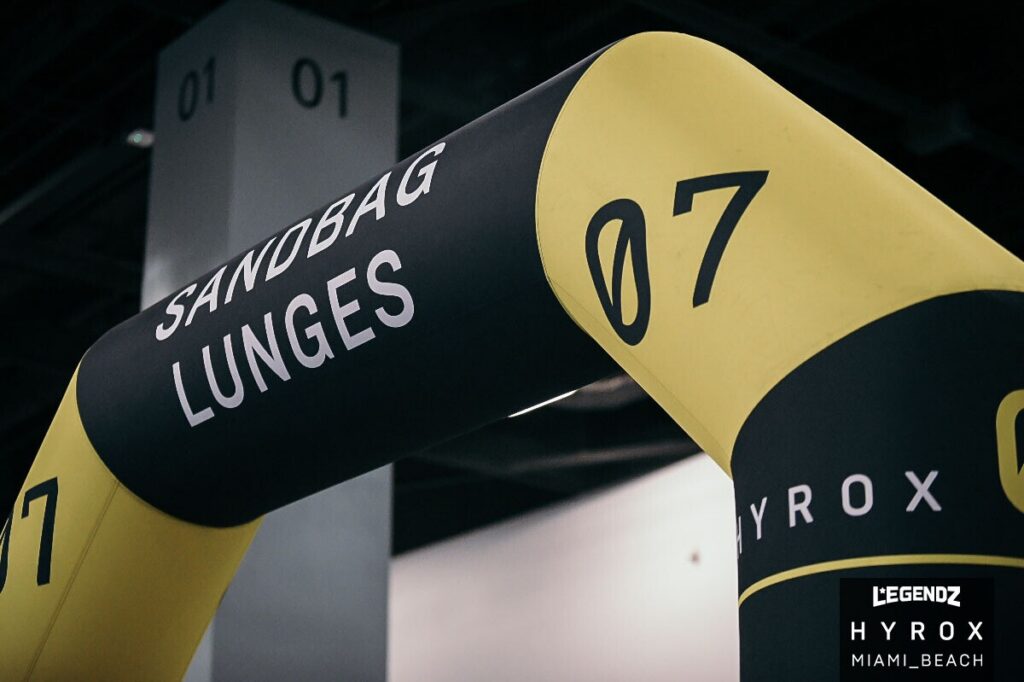 Sandbag lunges signage at HYROX race in Miami Beach