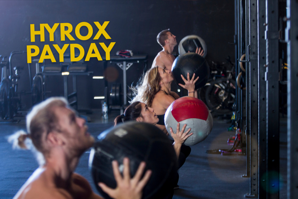 Athletes in a gym doing wall balls with text "HYROX PAYDAY"